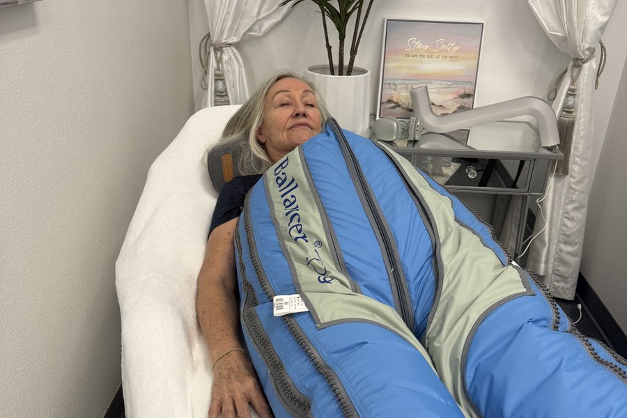 Client resting during a post-op lymphatic drainage session